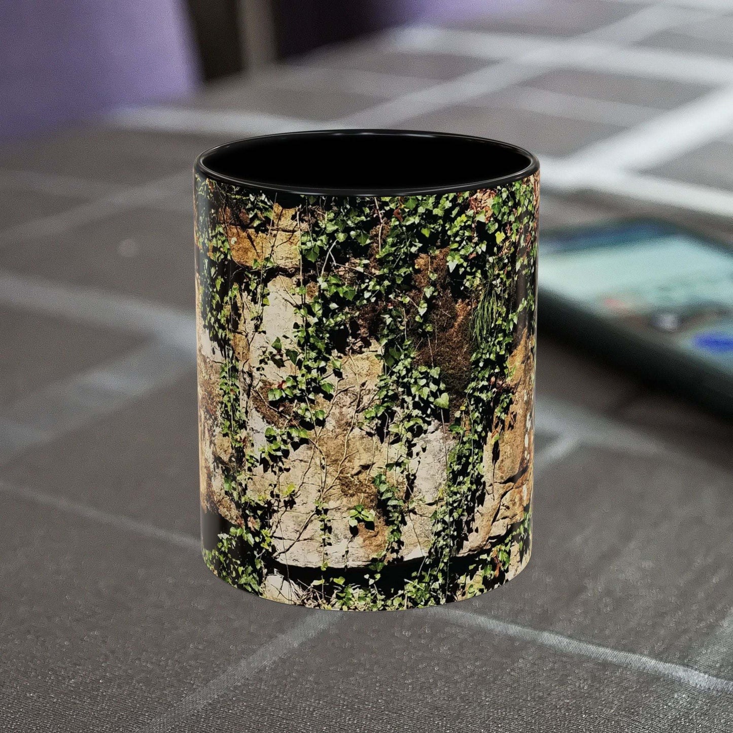 Overgrown Rocks Adventure Mug with nature-inspired design on a table.