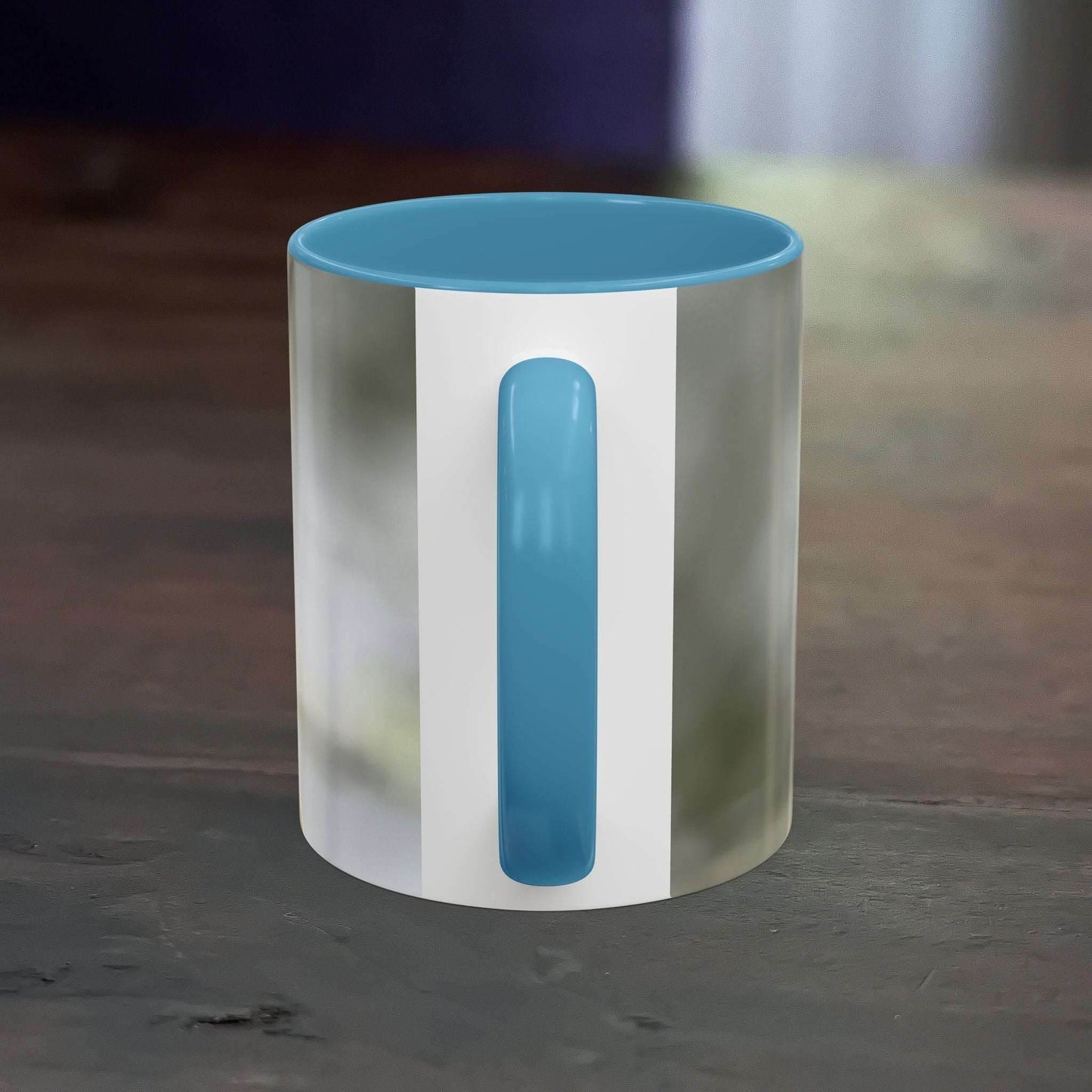 White ceramic mug with pretty dragonfly design and blue handle, 11oz capacity.
