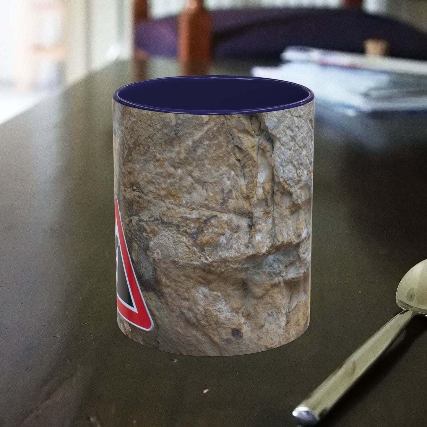 Rocky Mug with falling rocks design, perfect for mountain lovers and outdoor enthusiasts.