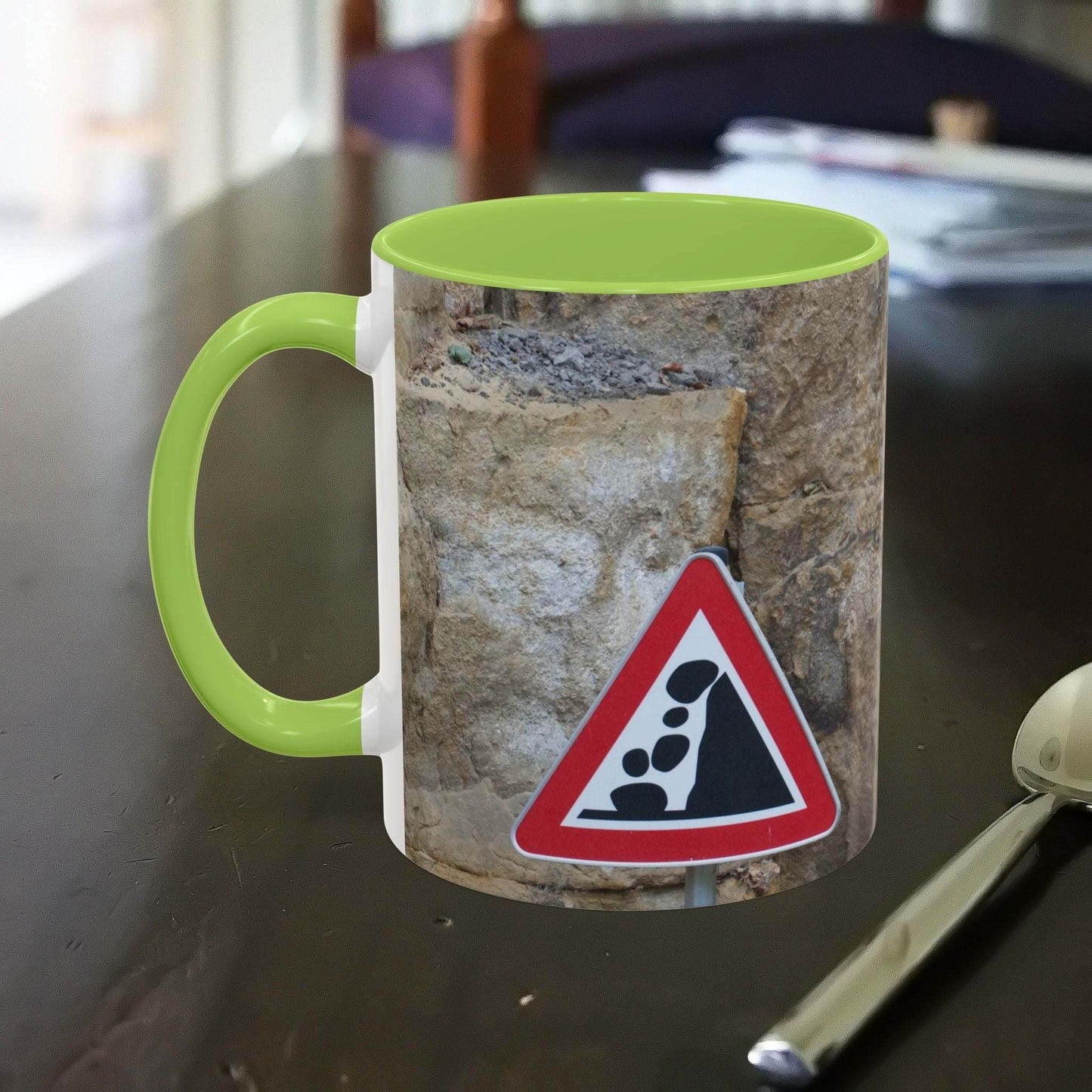 Rocky Mug with mountain design and falling rocks warning sign.