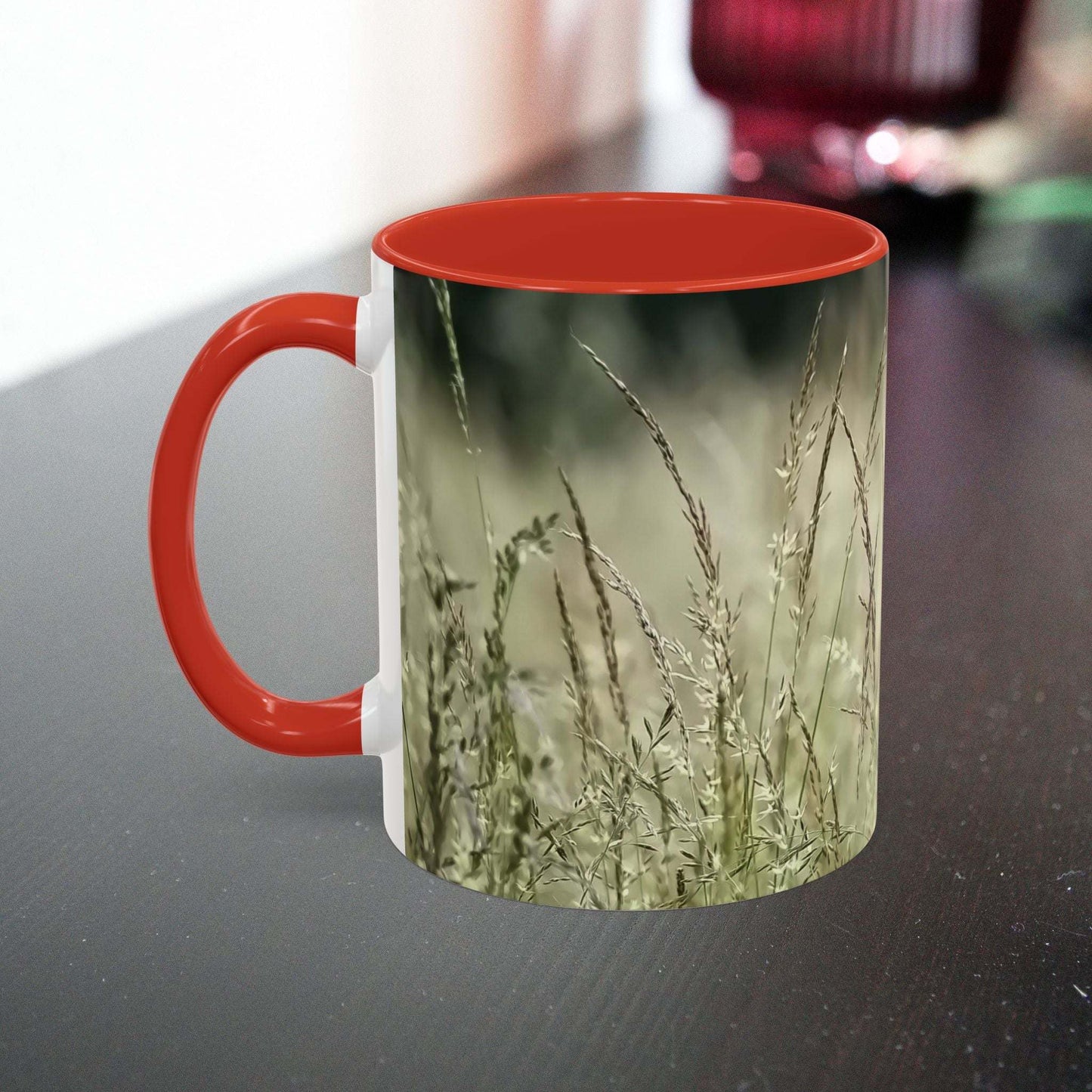 Flowering grass mug with red handle and interior, featuring a nature-inspired design.