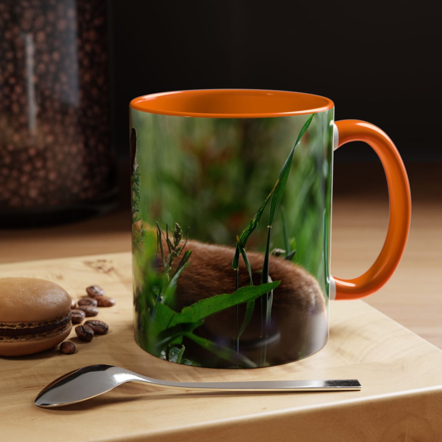 Wildlife Fox Ceramic Mug with nature illustration, orange interior, and sturdy handle on a wooden surface with coffee beans and a spoon nearby.