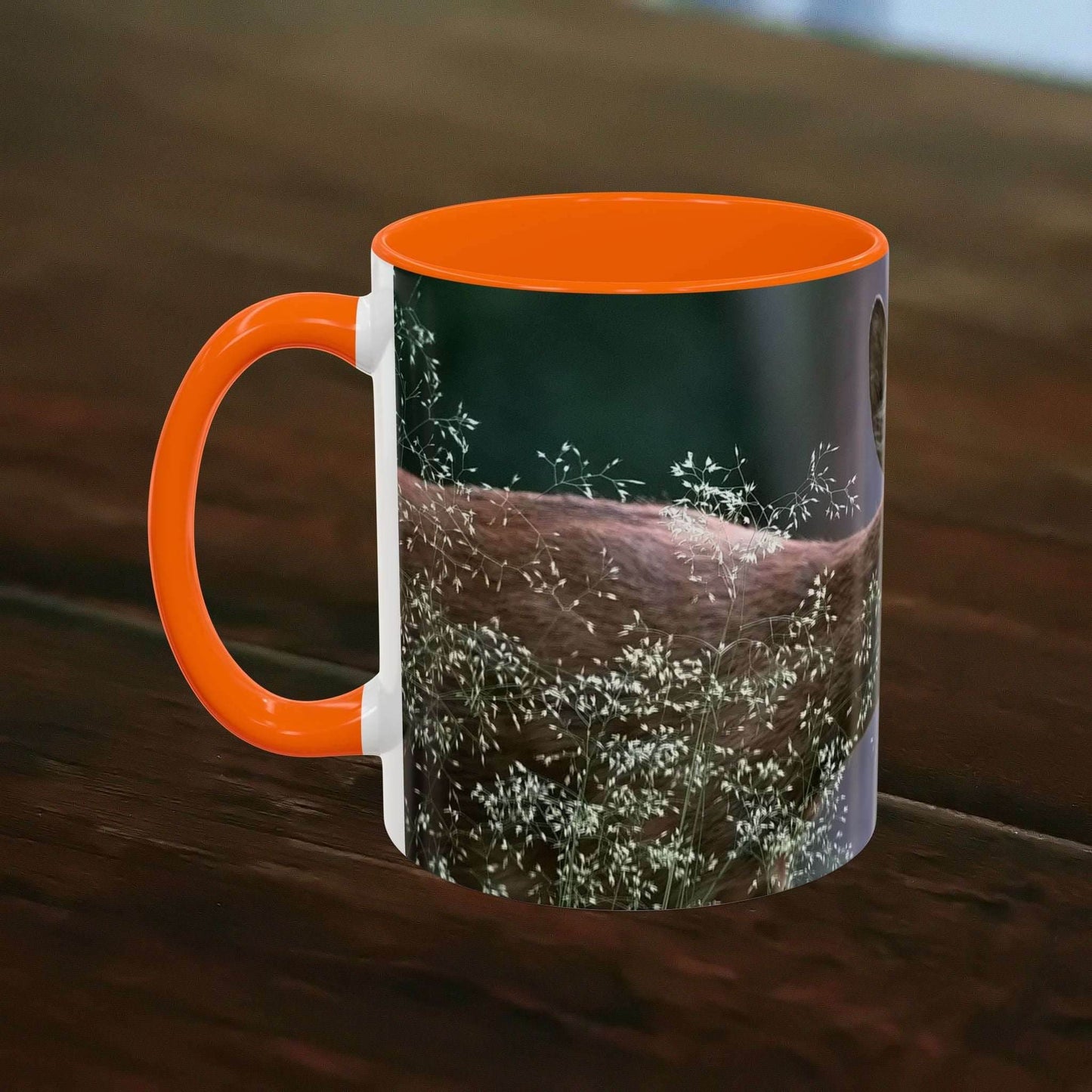 Nature-Inspired Deer Ceramic Mug - 11oz with orange interior and deer design on wooden table.