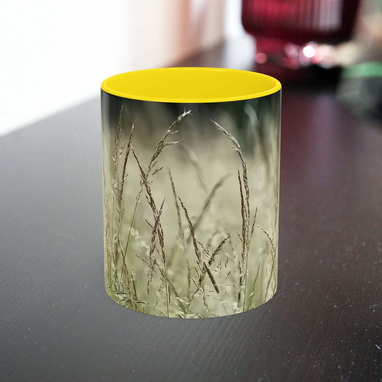Ceramic mug with flowering grass design, bringing nature inside.
