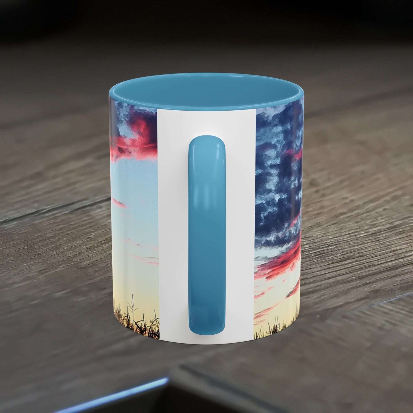 Sunset Accent Coffee Mug with vibrant colors and glossy finish on wood surface.