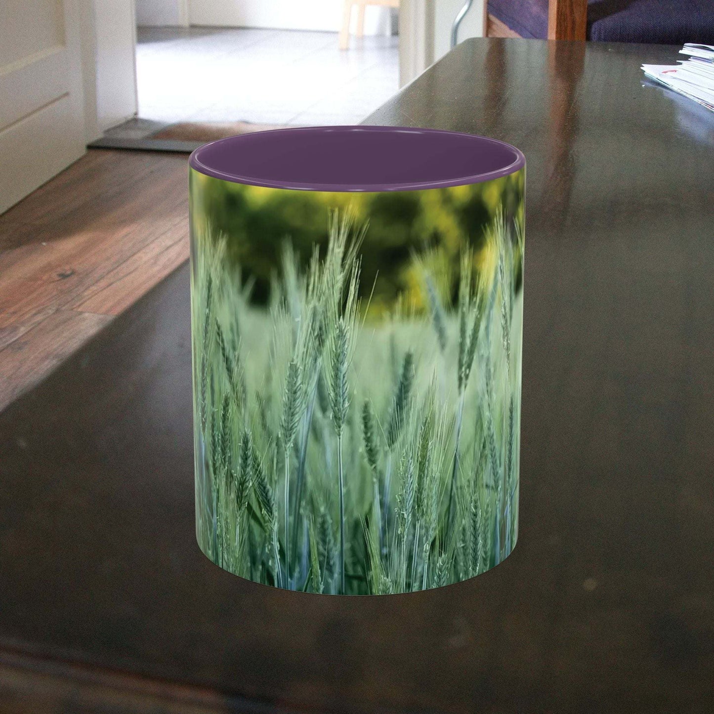 Wheat field design coffee mug on wooden table.