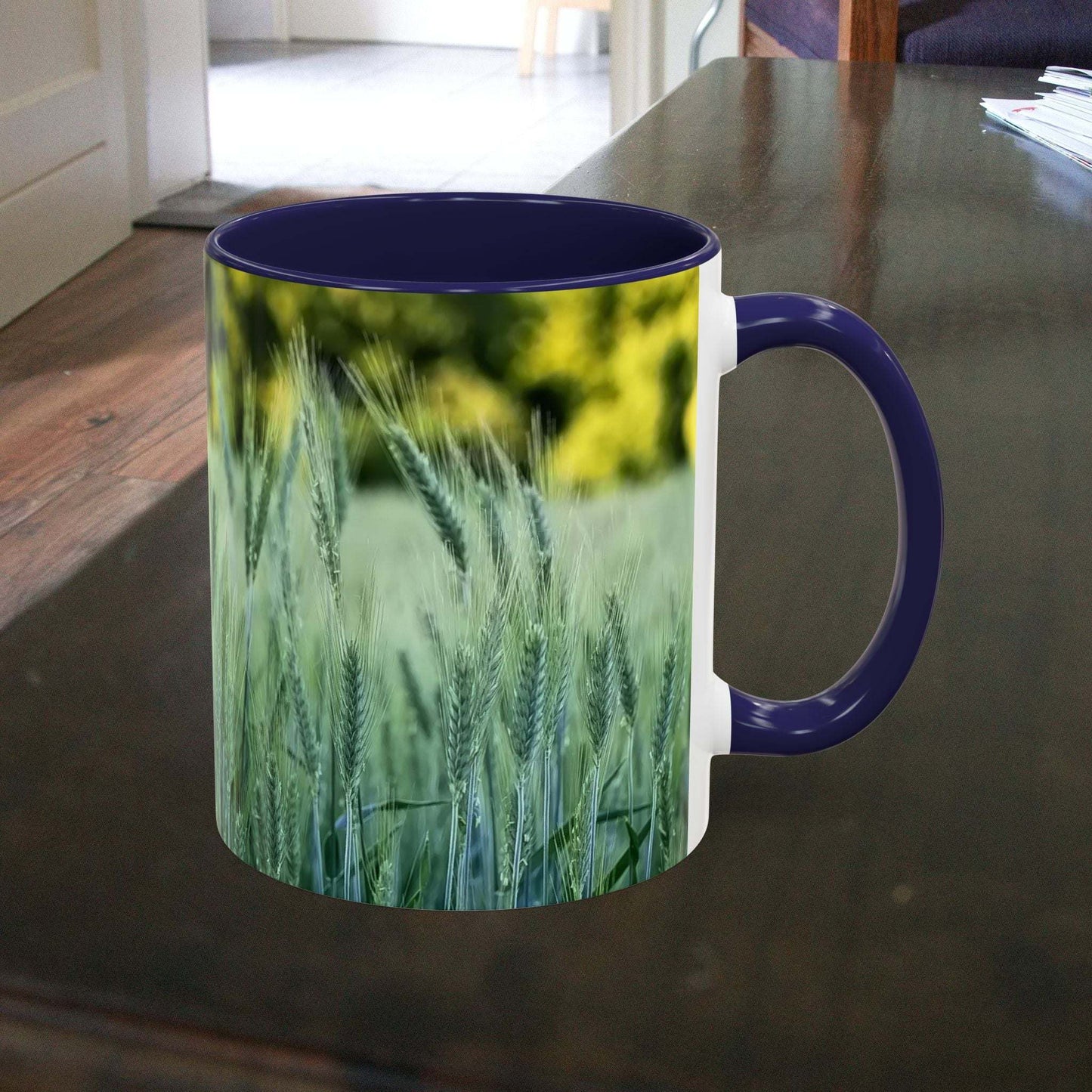 Wheat field design coffee mug on a table, perfect for nature lovers.