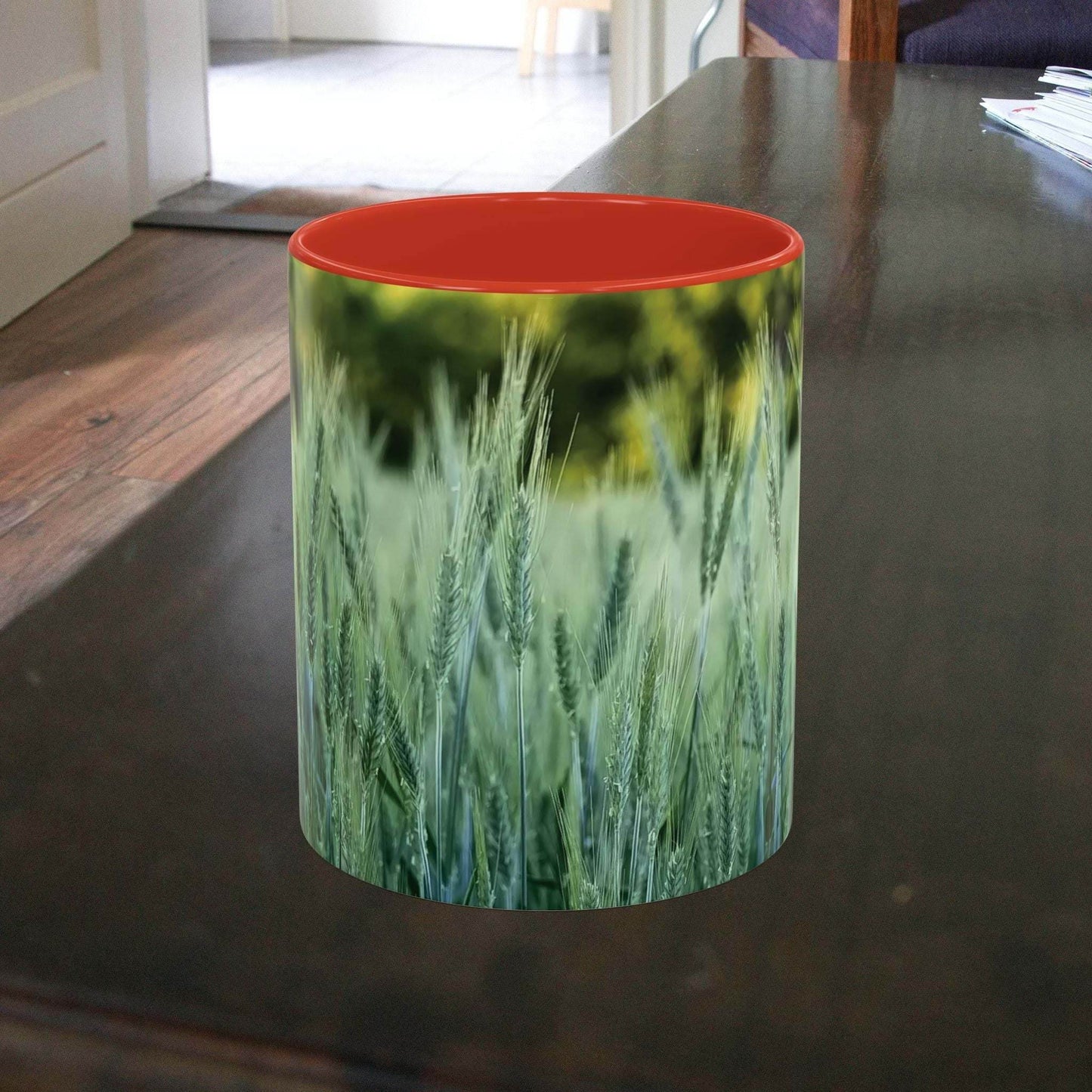 Wheat field design coffee mug on a table, ideal for nature lovers.