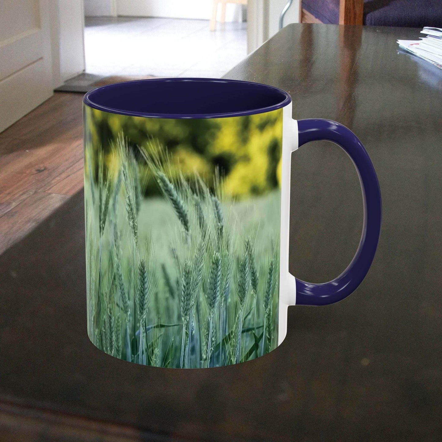 Wheat field design coffee mug on wooden table.