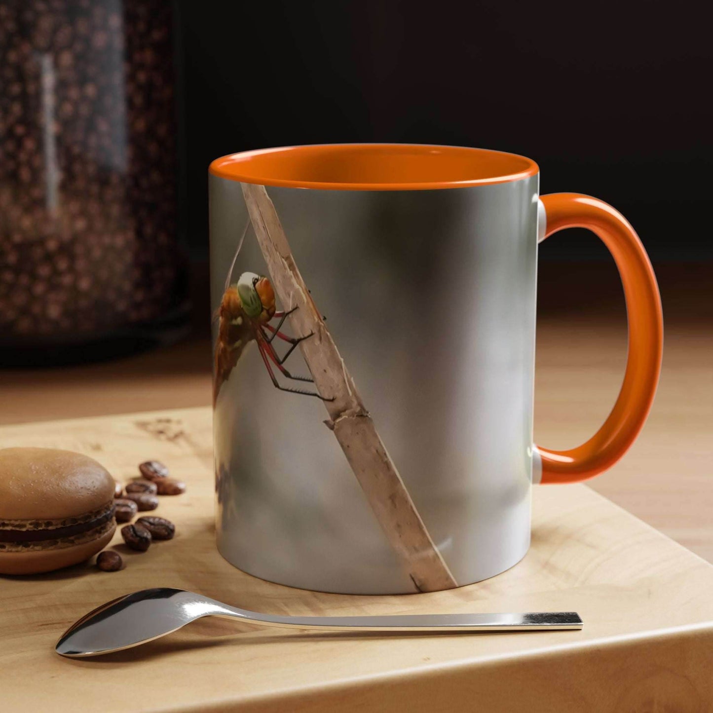 White ceramic mug with a vibrant dragonfly design, glossy finish, and ergonomic handle, perfect for coffee or tea.