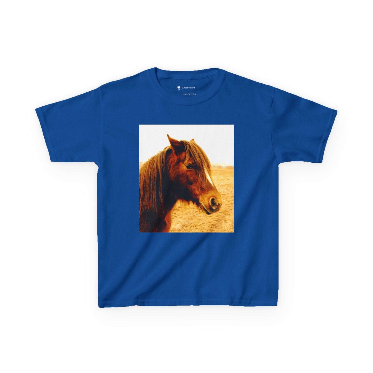 Kids Tee with horse print design on blue fabric.