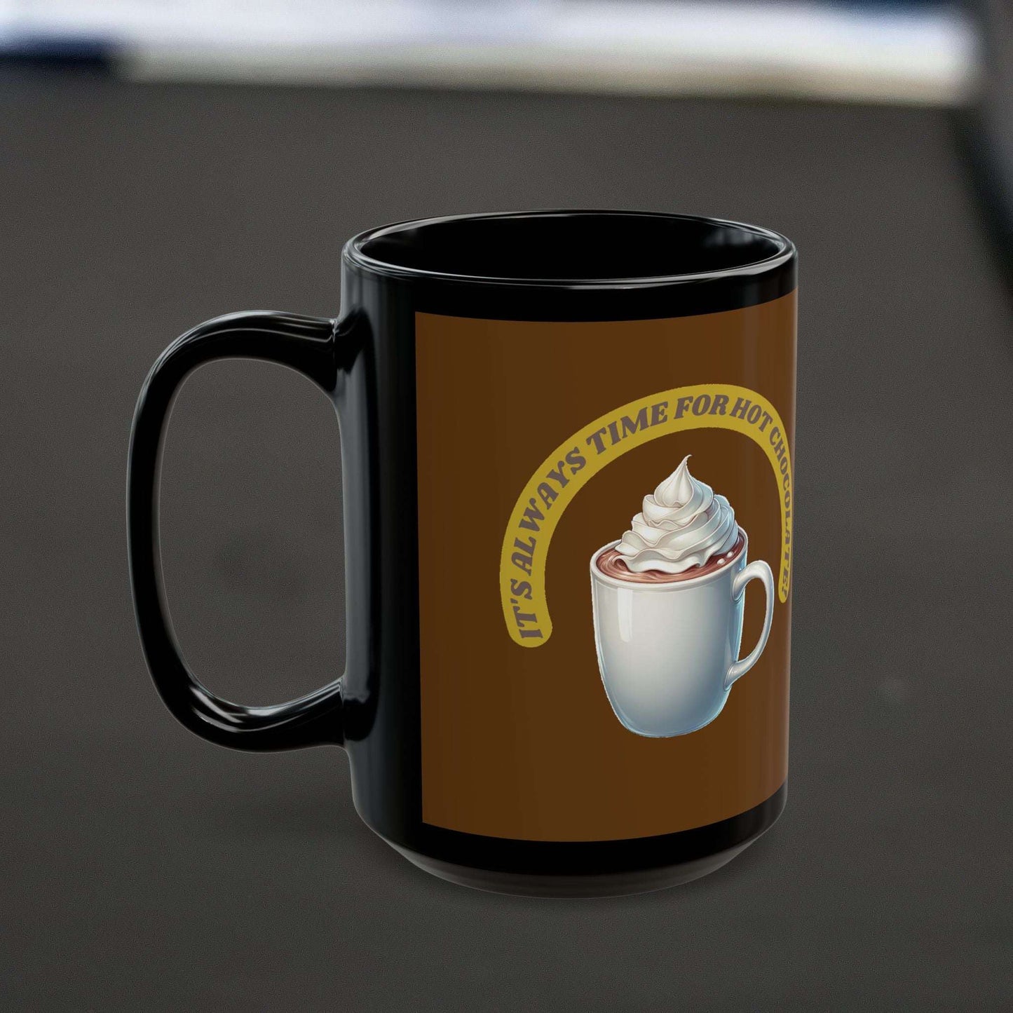 Black ceramic mug with "It's always time for hot chocolate" design, perfect for hot beverages.