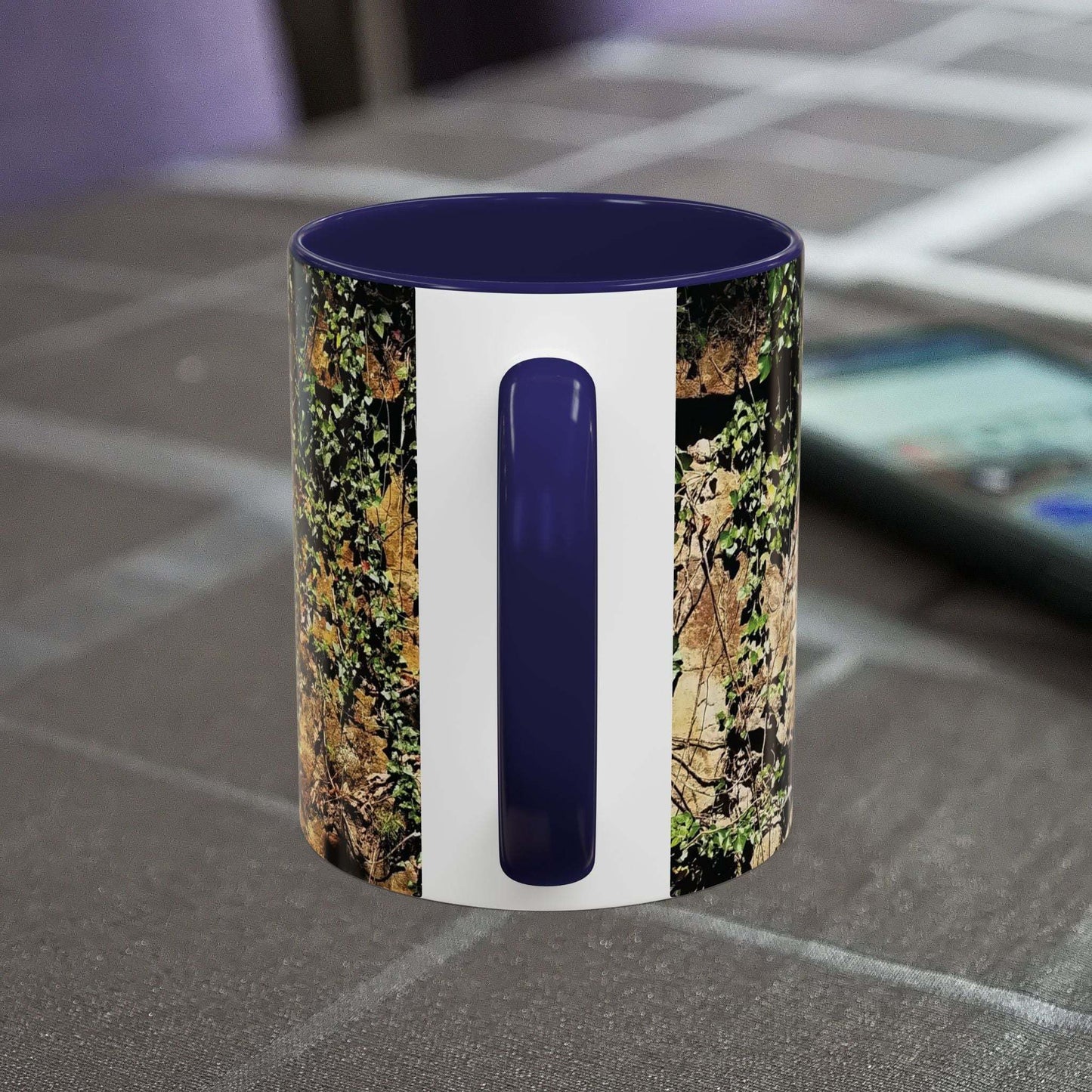Overgrown Rocks Adventure Mug with nature-inspired design on table.