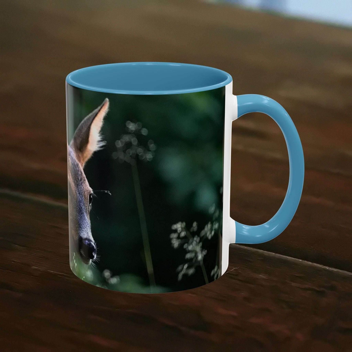 Nature-Inspired Deer Ceramic Mug - 11oz with elegant deer and floral design on a wooden table.