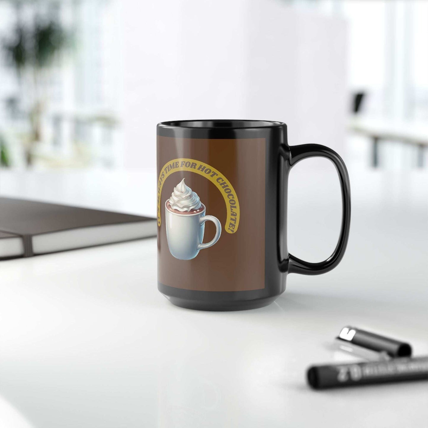 Black ceramic mug with "It's always time for hot chocolate" design, available in 11oz and 15oz sizes.