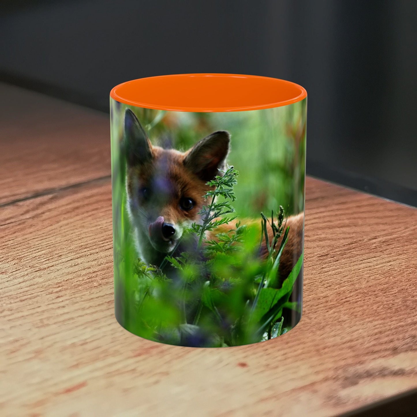 Fox-inspired accent coffee mug with wildlife design on wooden surface.
