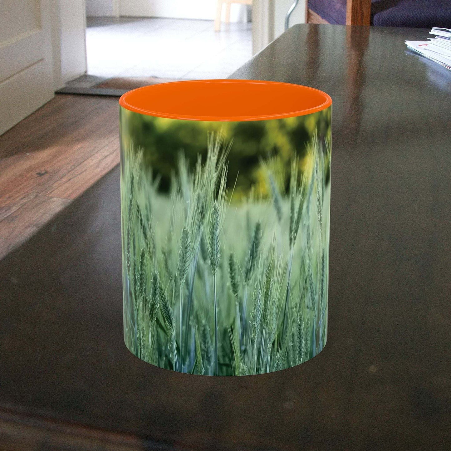 Wheat field design coffee mug on a table.