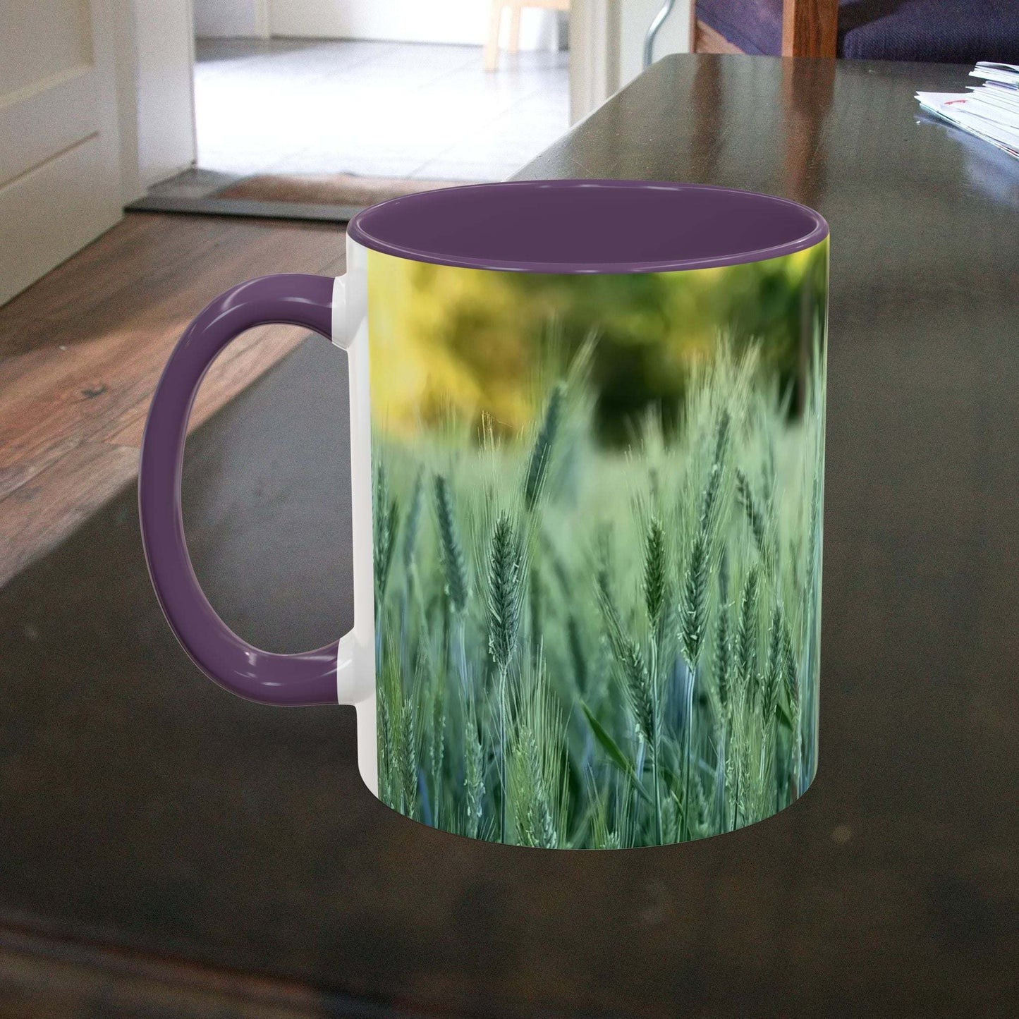 Wheat Field Design coffee mug on a table, featuring a serene nature scene.