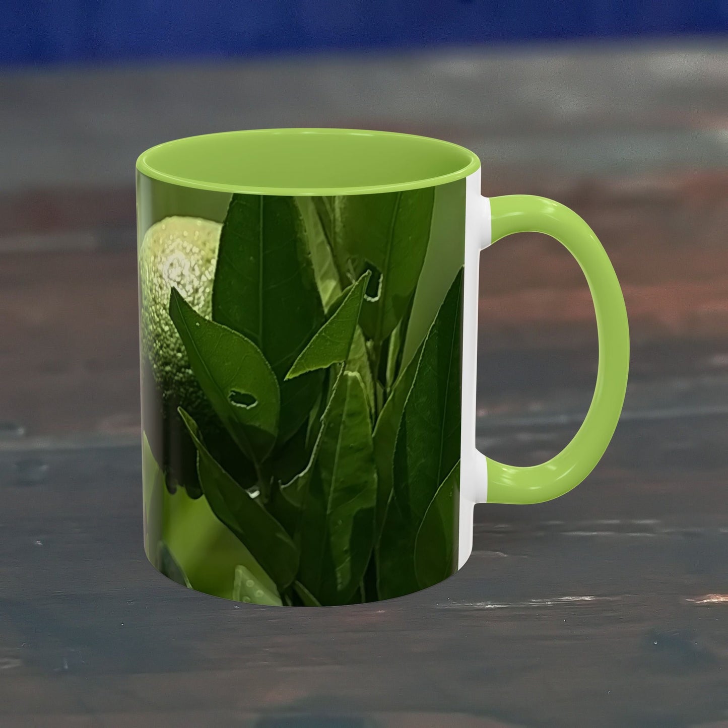 Vibrant green fruit coffee mug with colorful leaf design, 325ml, microwave and dishwasher safe.
