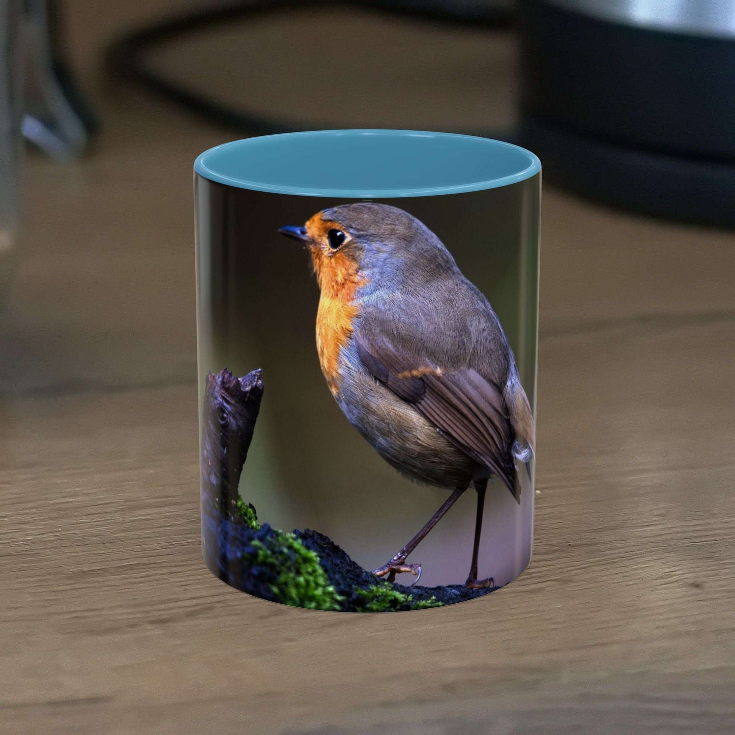 White ceramic mug featuring a vibrant robin illustration, 11oz size.