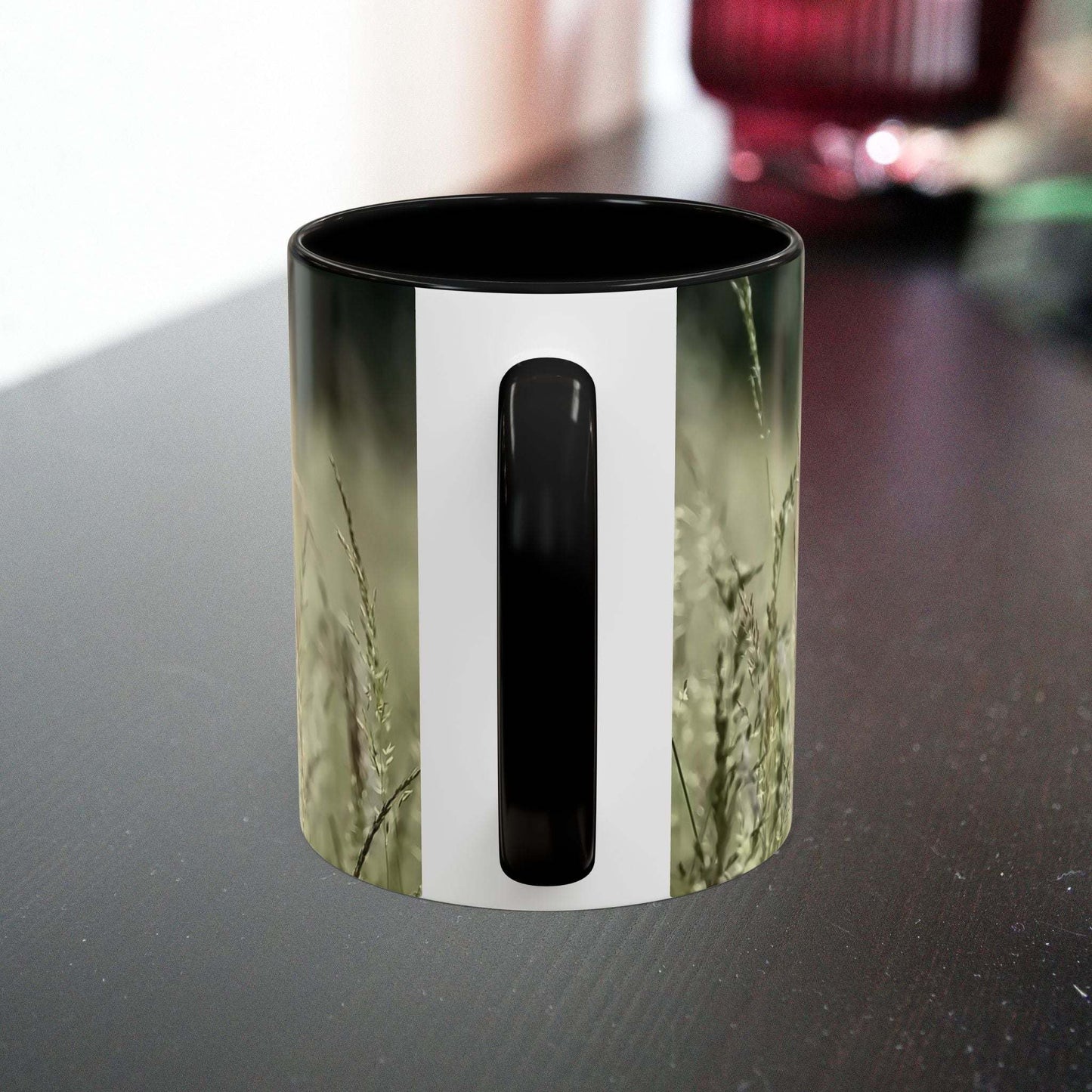 Ceramic mug with flowering grass design, perfect for nature lovers.