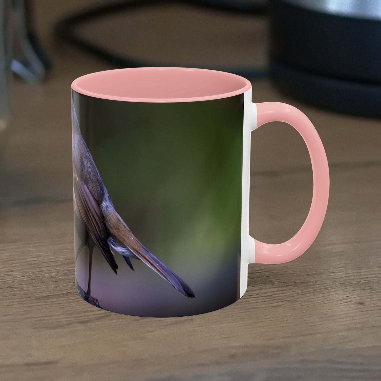 White ceramic 11oz Robin Mug with vibrant robin illustration, glossy finish.