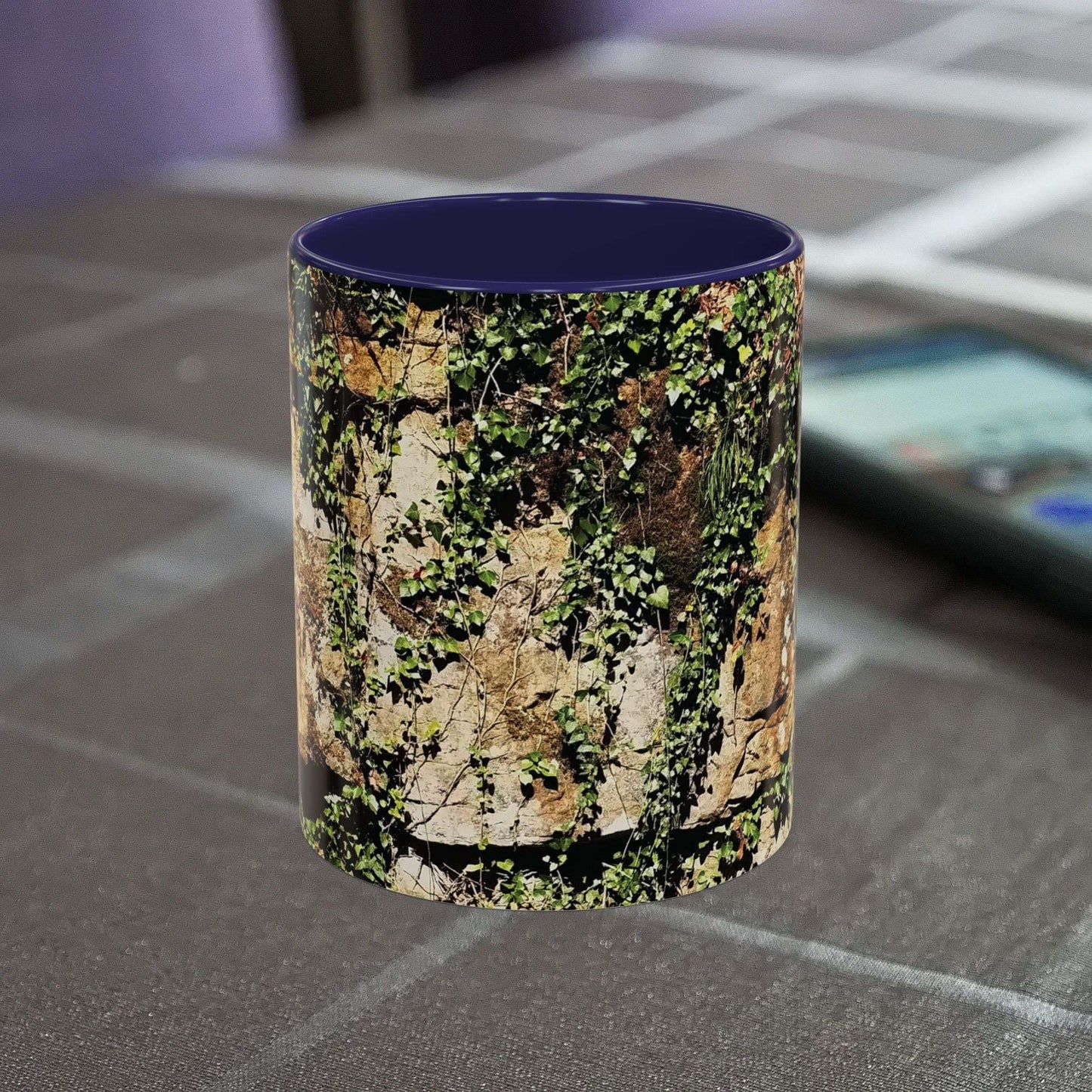 Overgrown Rocks Adventure Mug with outdoor design on table