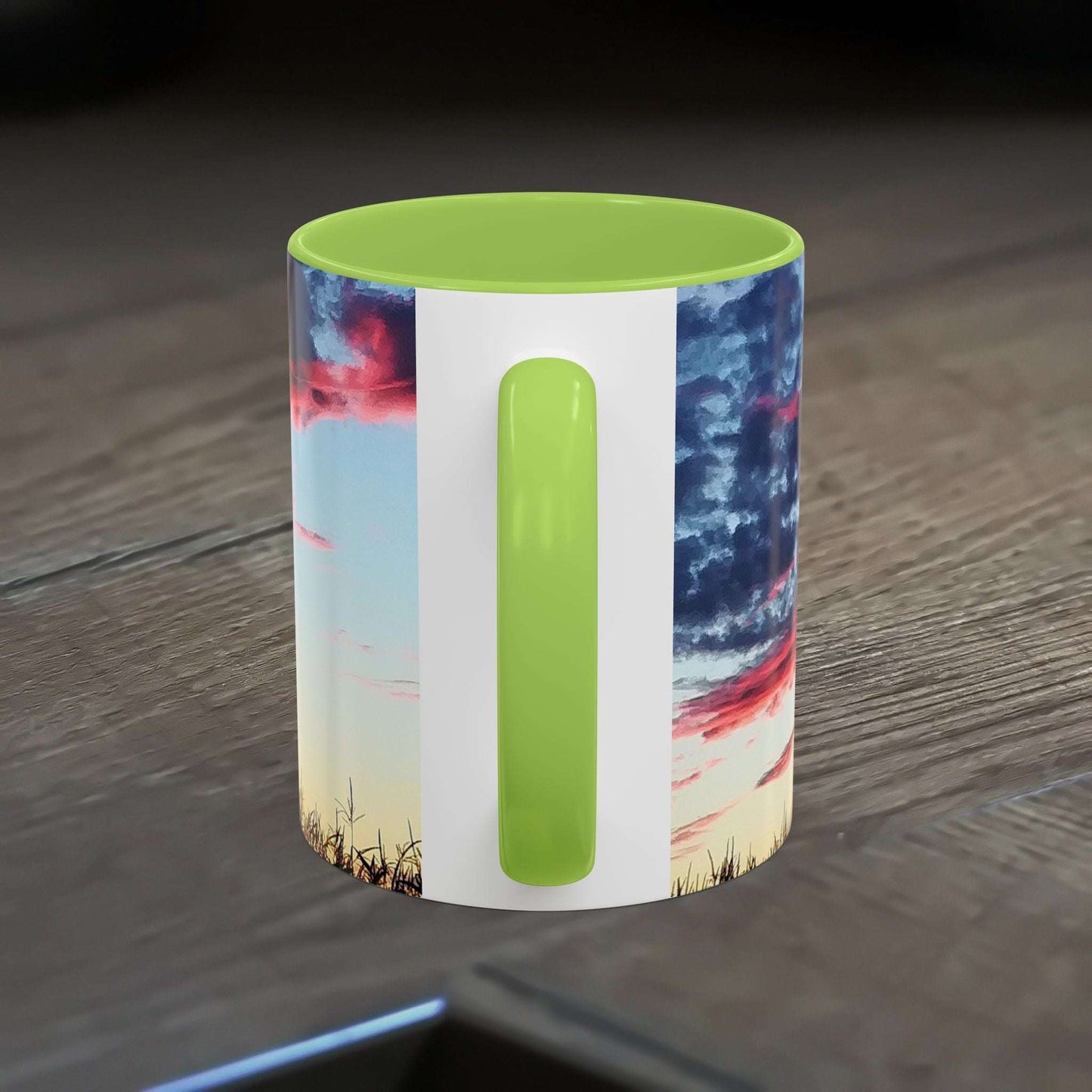 Vibrant Sunset Accent Coffee Mug with artistic design on a wooden table.
