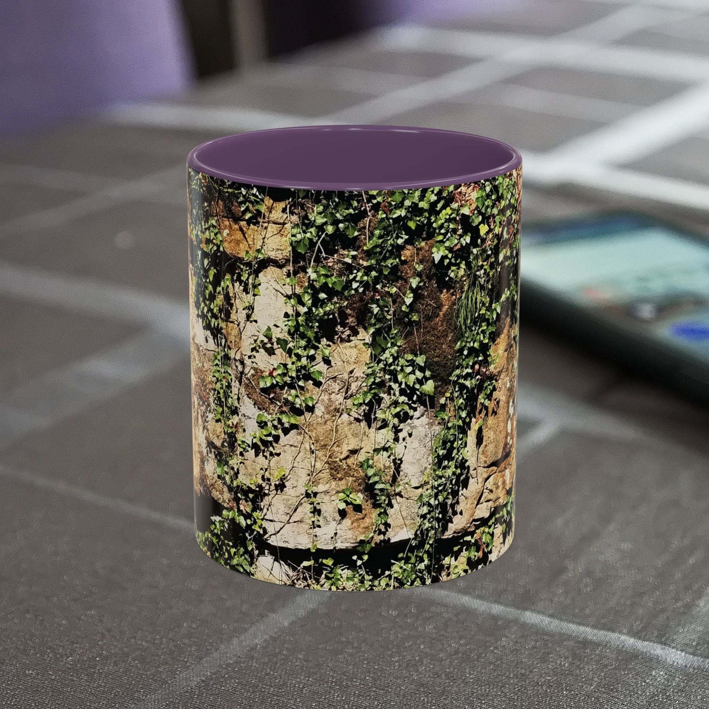 Overgrown rocks adventure mug with nature-inspired design on tabletop.
