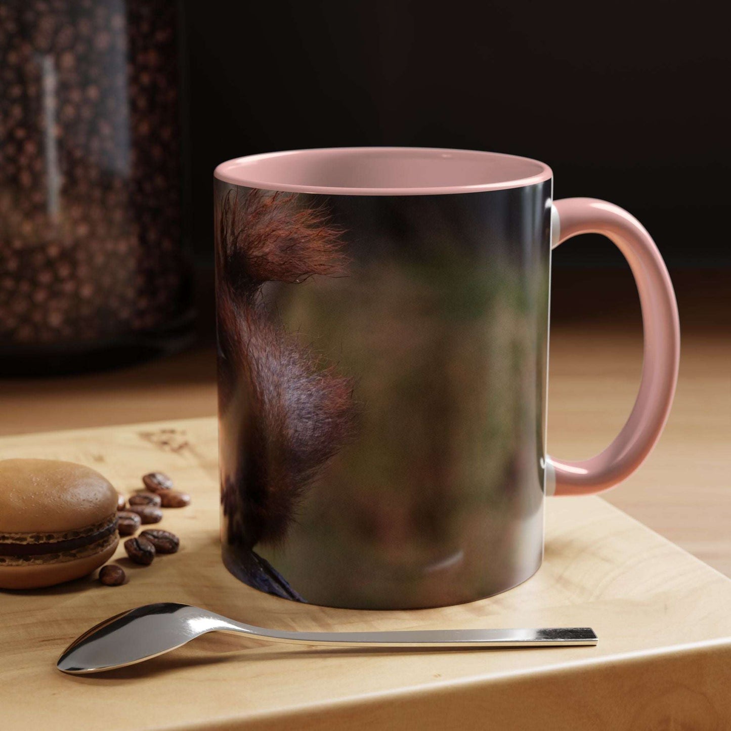 Adorable Squirrel Ceramic Mug on a wooden table, showcasing nature-inspired design with a pink handle and smooth finish.