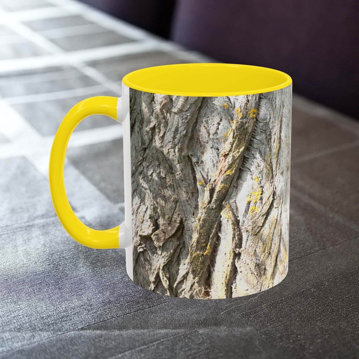 Coffee mug with rustic tree trunk design and yellow interior, ideal for nature lovers.