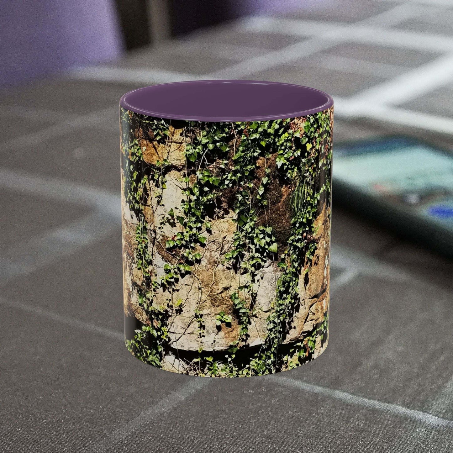 Overgrown Rocks Adventure Coffee Mug with nature design on table