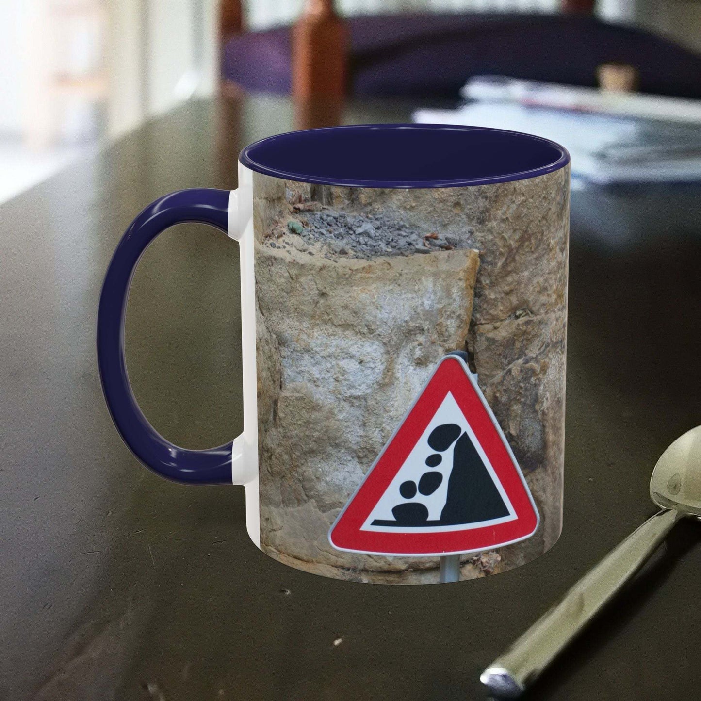 Rocky Mug with falling rocks design, perfect for mountain lovers and outdoor enthusiasts.