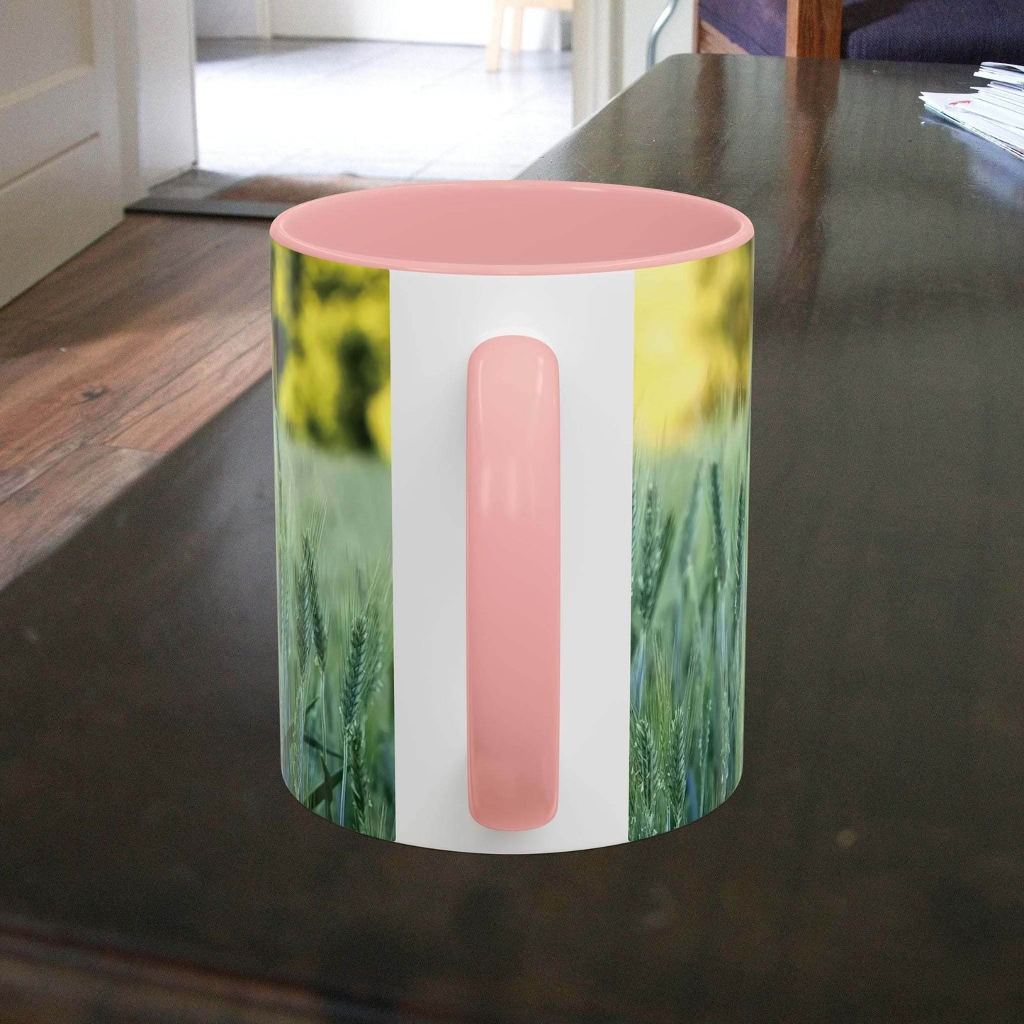 Wheat field design coffee mug on a wooden table.