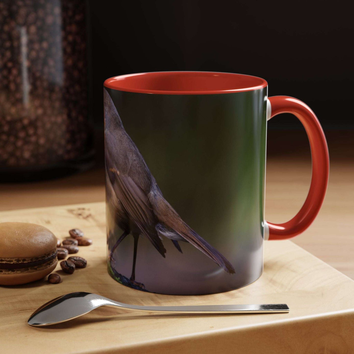 White ceramic 11oz Robin Mug with vibrant bird illustration and red interior, for coffee or tea.