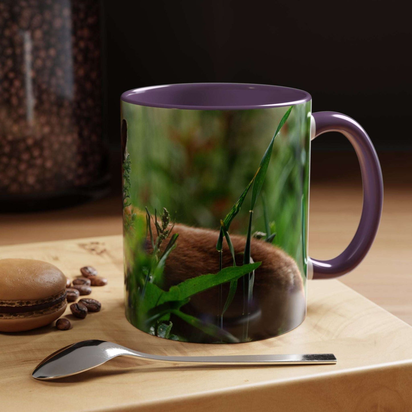Wildlife Fox Ceramic Mug with forest-inspired design on a wooden surface, accompanied by a macaron and spoon.