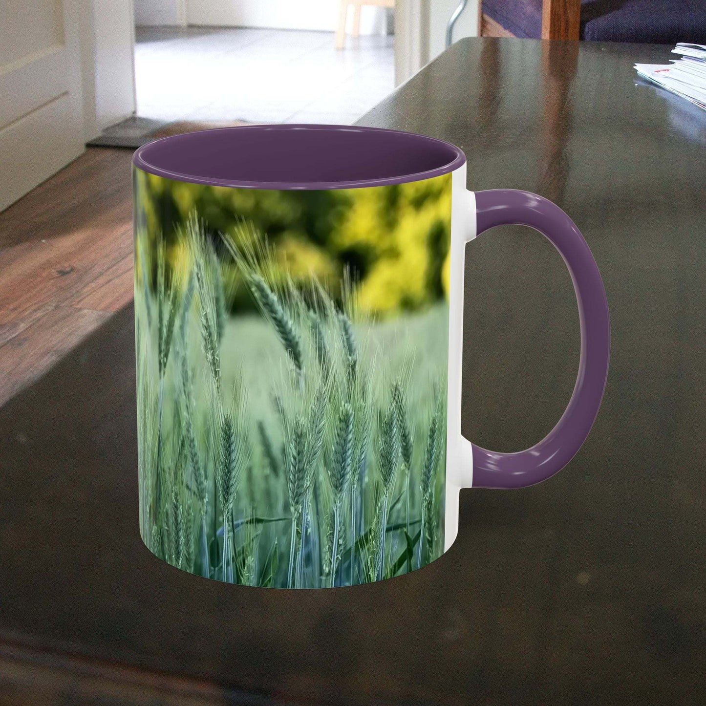Wheat field design coffee mug on table, nature-themed gift for tea or coffee lovers.