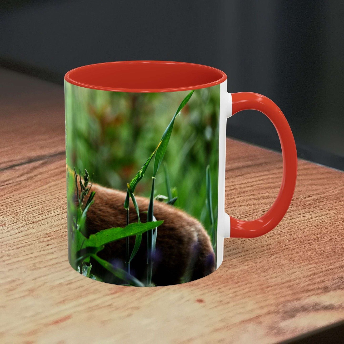 Fox-inspired accent coffee mug on wooden surface with vibrant nature design.