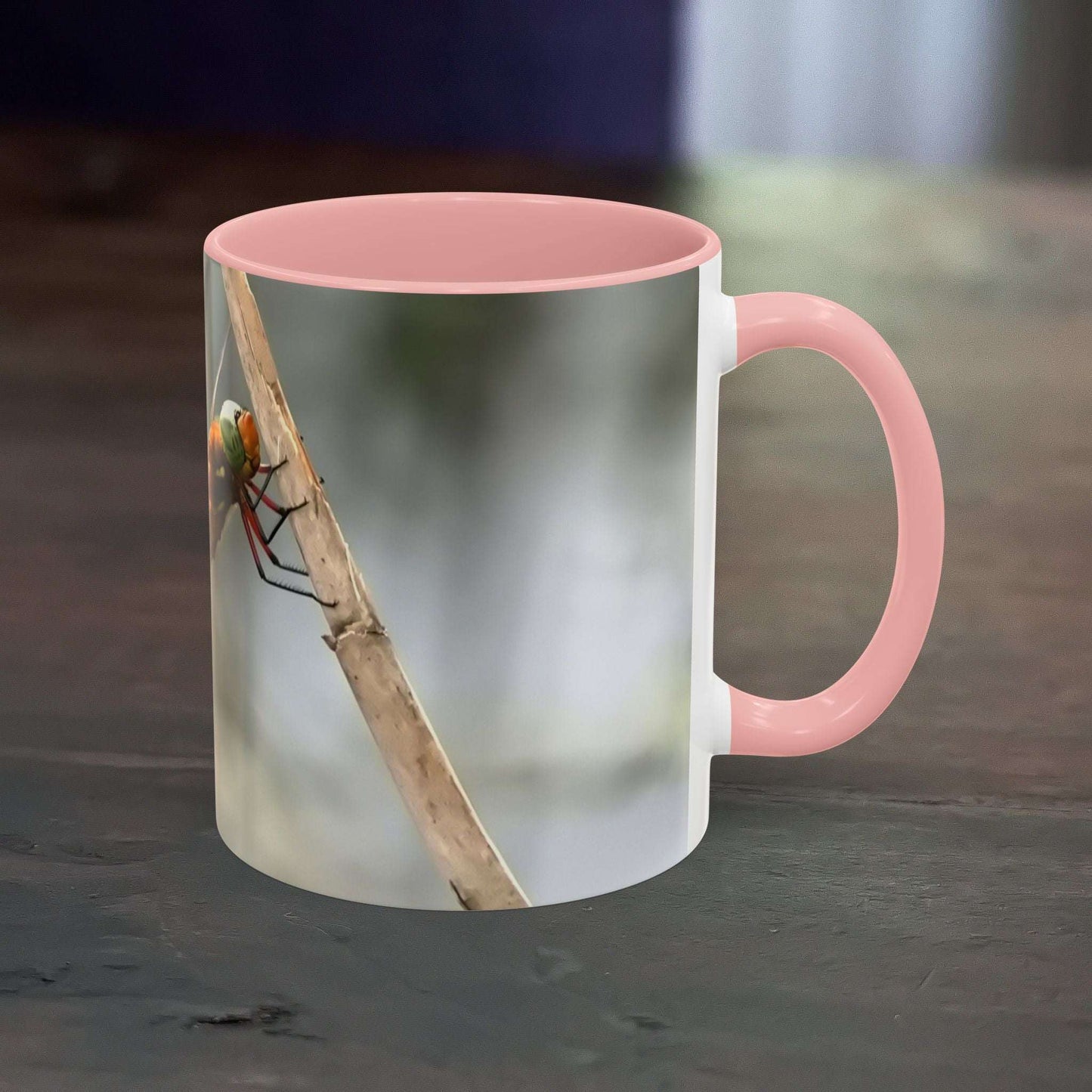 Pretty dragonfly accent coffee mug with pink handle and interior, ideal for hot beverages.