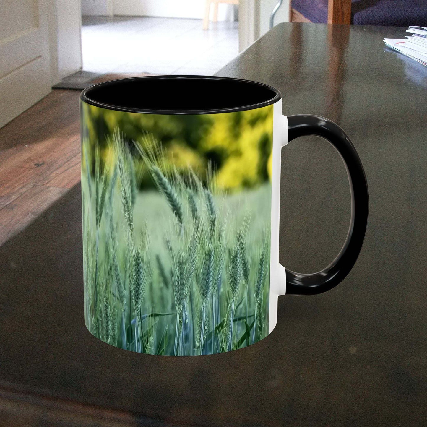 Wheat field design coffee mug on a wooden table.