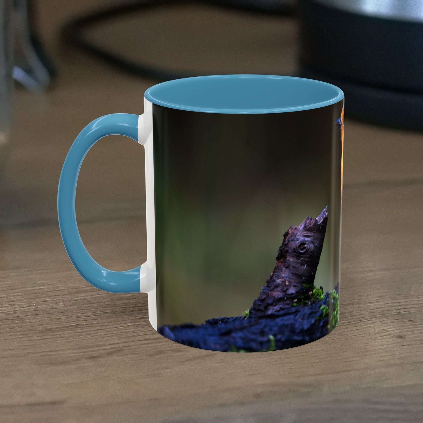 White ceramic 11oz mug with vibrant robin illustration, glossy finish; perfect for nature lovers.