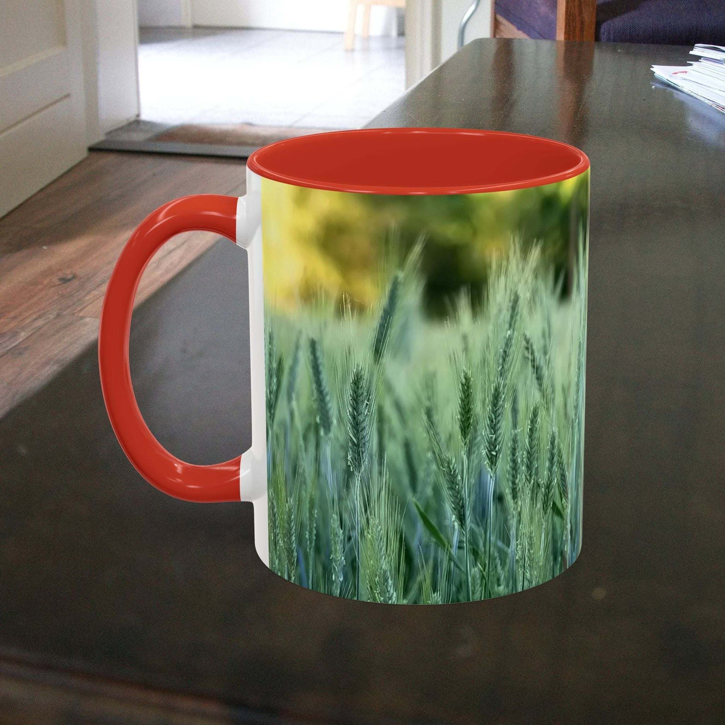 Wheat field design coffee mug with nature-inspired artwork and red interior.