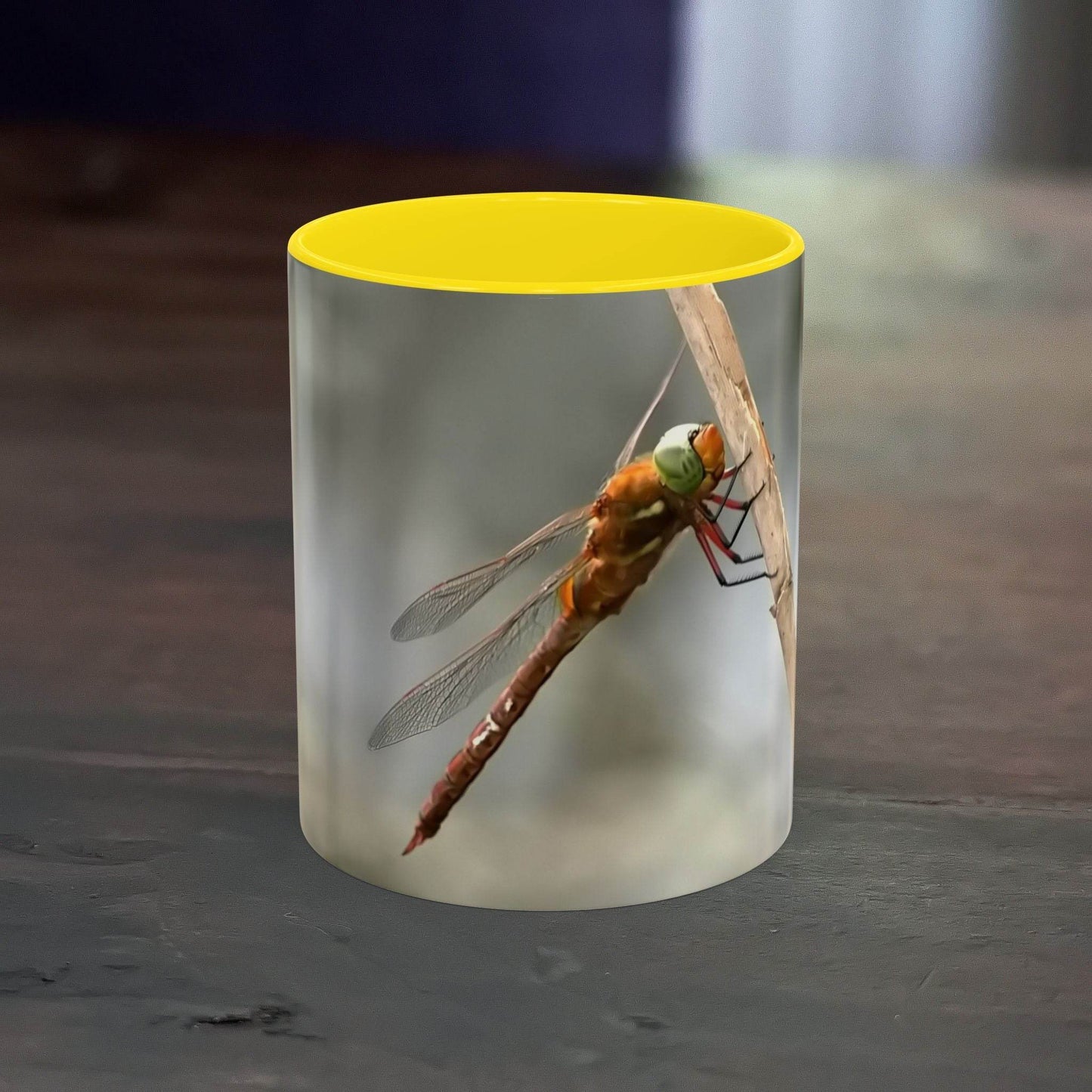 White ceramic mug with a vibrant dragonfly design, 11oz capacity.