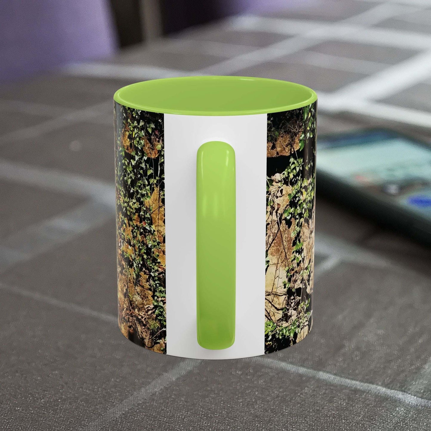 Overgrown Rocks Adventure Mug with nature-inspired design on table.