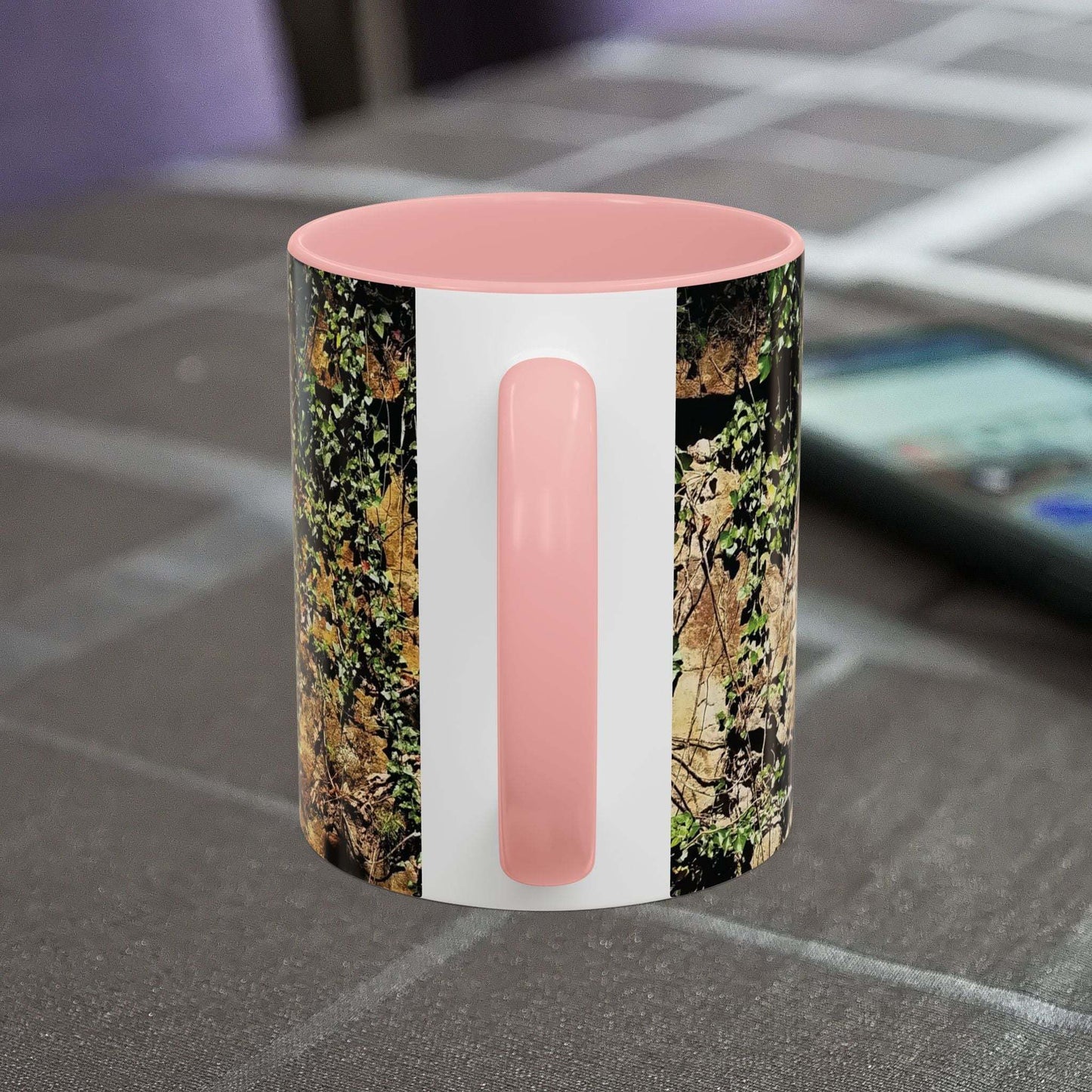 Overgrown Rocks Adventure Mug with nature-inspired design on table.