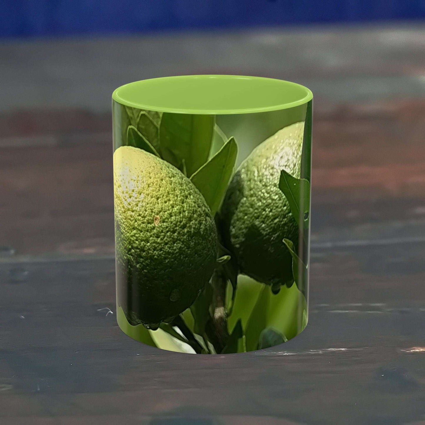 Vibrant fruit coffee mug with green lime design, glossy finish, and C-shaped handle.