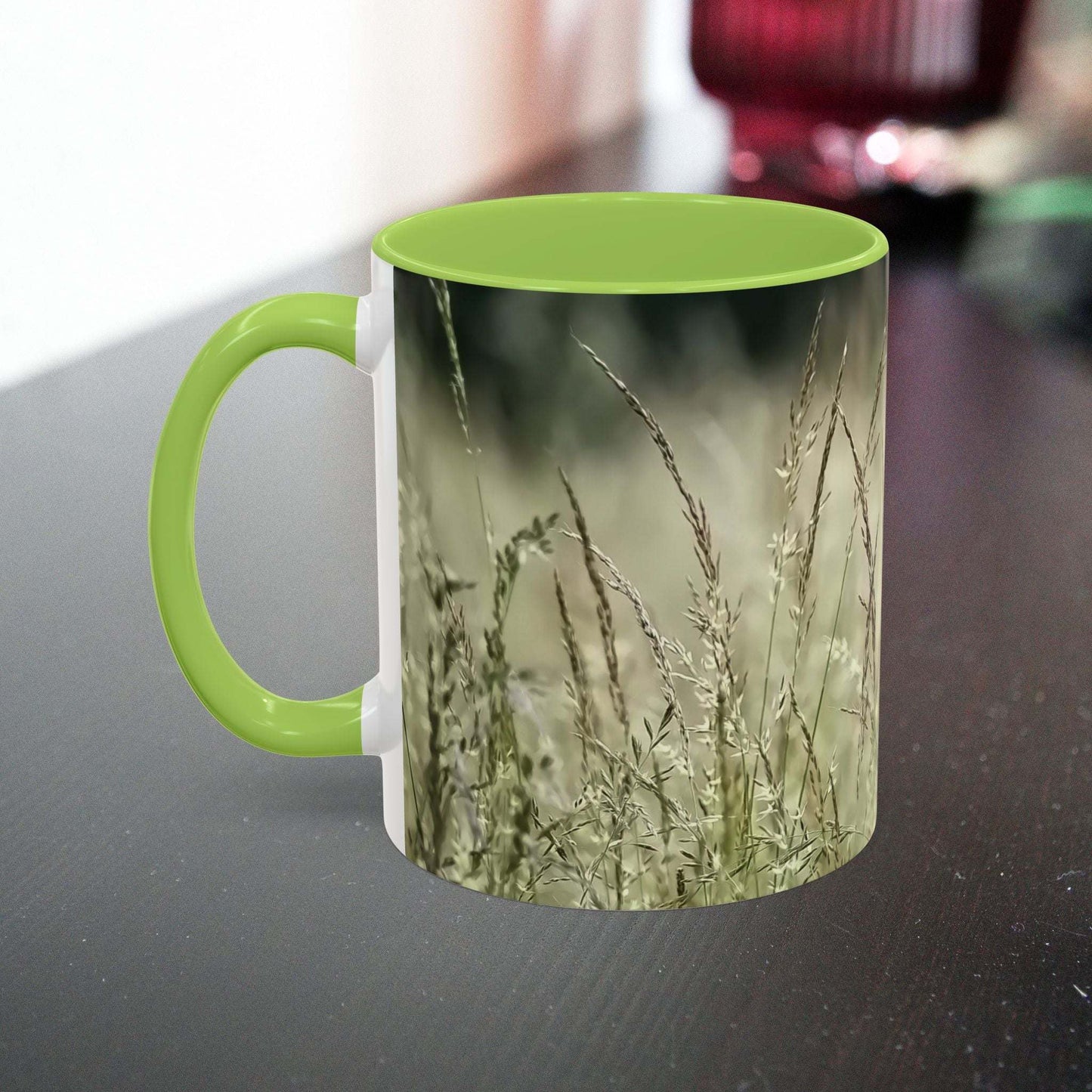 Ceramic mug with flowering grass design, featuring green interior and handle, perfect for nature lovers.