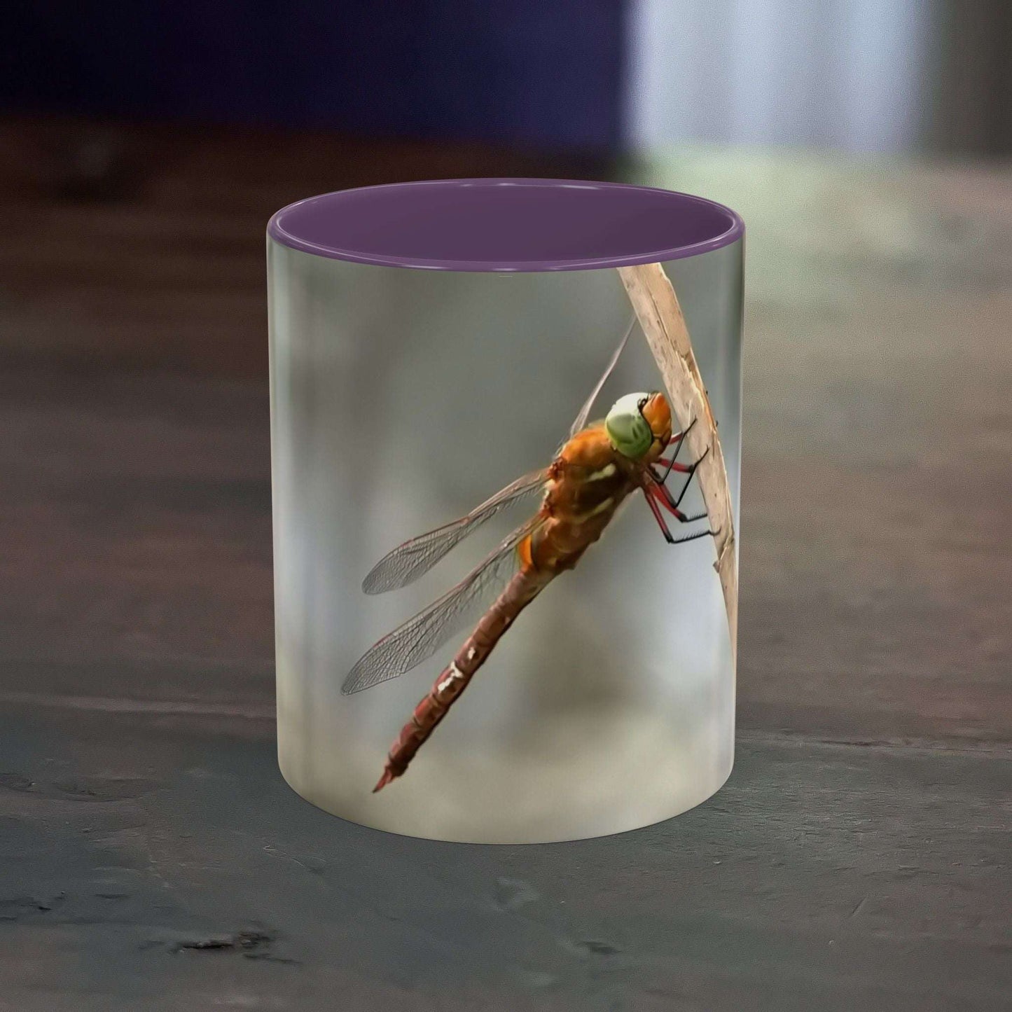 Pretty dragonfly accent coffee mug with vibrant colors and contrast handle.