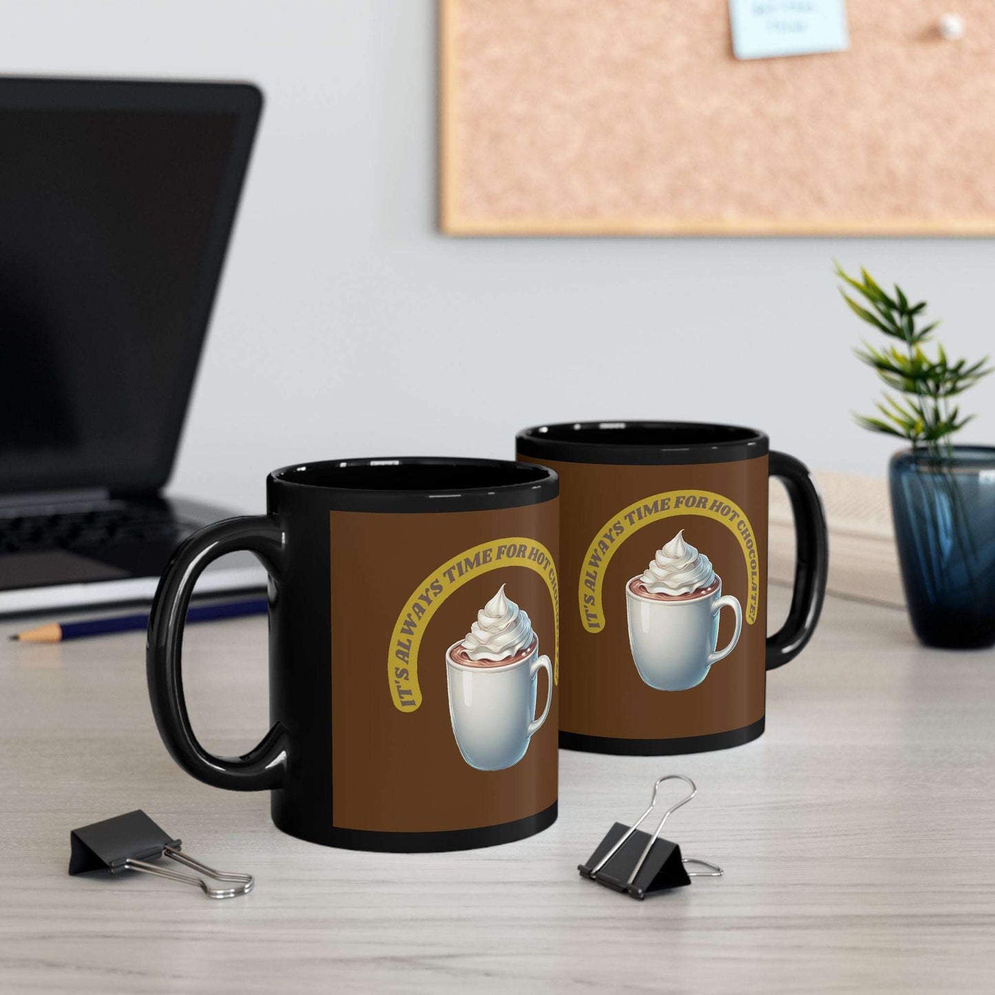 Black ceramic mug with "It's always time for hot chocolate" design, available in 11oz and 15oz, glossy finish, ideal for hot beverages.