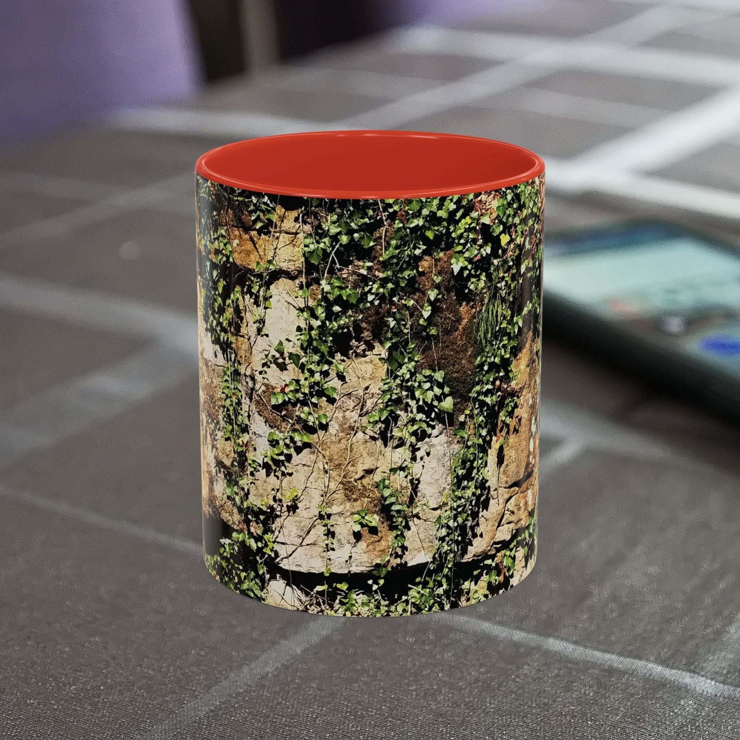 Overgrown Rocks Adventure Mug with nature-inspired design on a table.